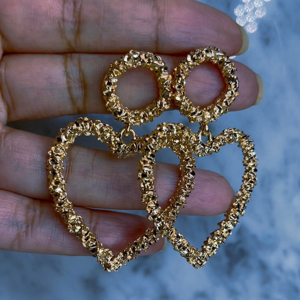 Amor - Gold Nugget Heart Earrings Stunning, dangly, head turning, gold nugget, heart shaped earrings. 2" in length and 1 1/2" wide at their widest point, with a push back earring post that secures snug to the back of the ear. 