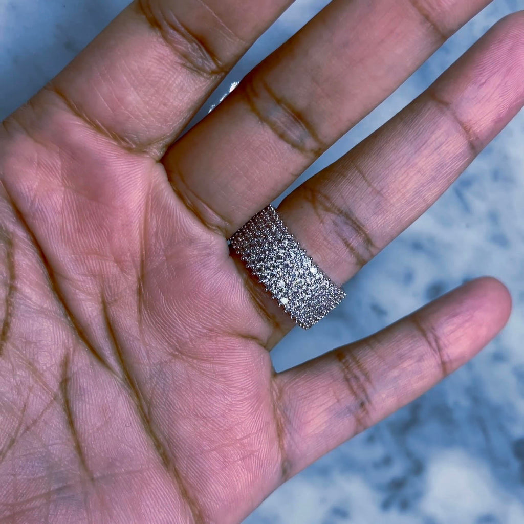 Hielo - Diamond Pave Ring This ring is beyond beautiful! The way it shimmers and sparkles in the light is amazing. The crystals appear to never end because of their silver colored pave setting. 1/2" width, tarnish and water resistant.